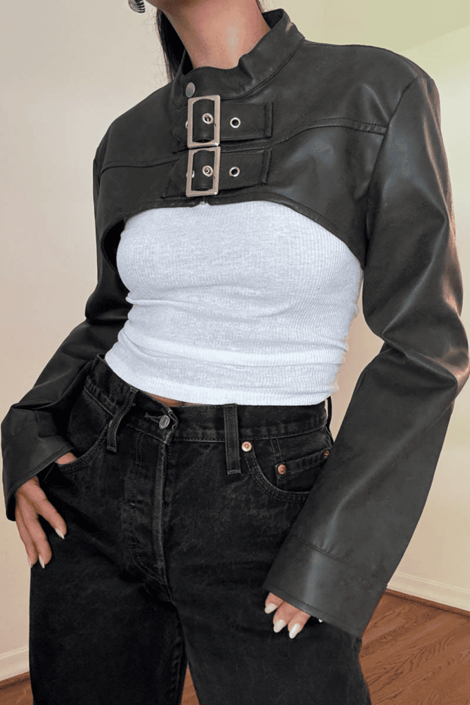 Woman in stylish black jacket and jeans.