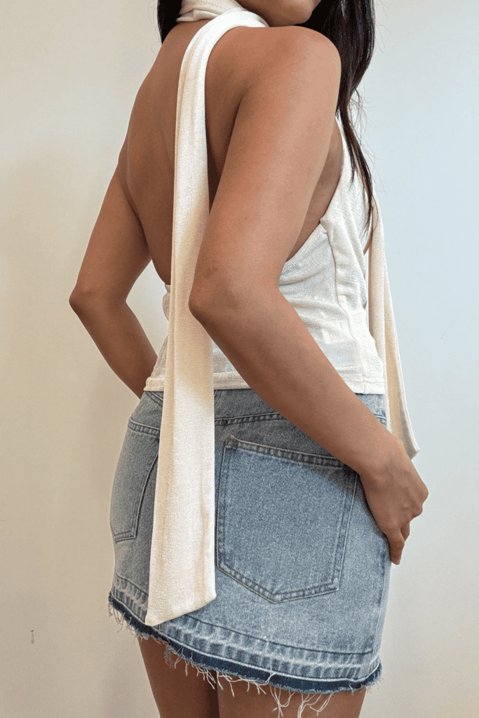 Back view of outfit with denim skirt.